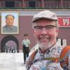 Edward J Carpenter standing in front of the Forbidden City, headshot