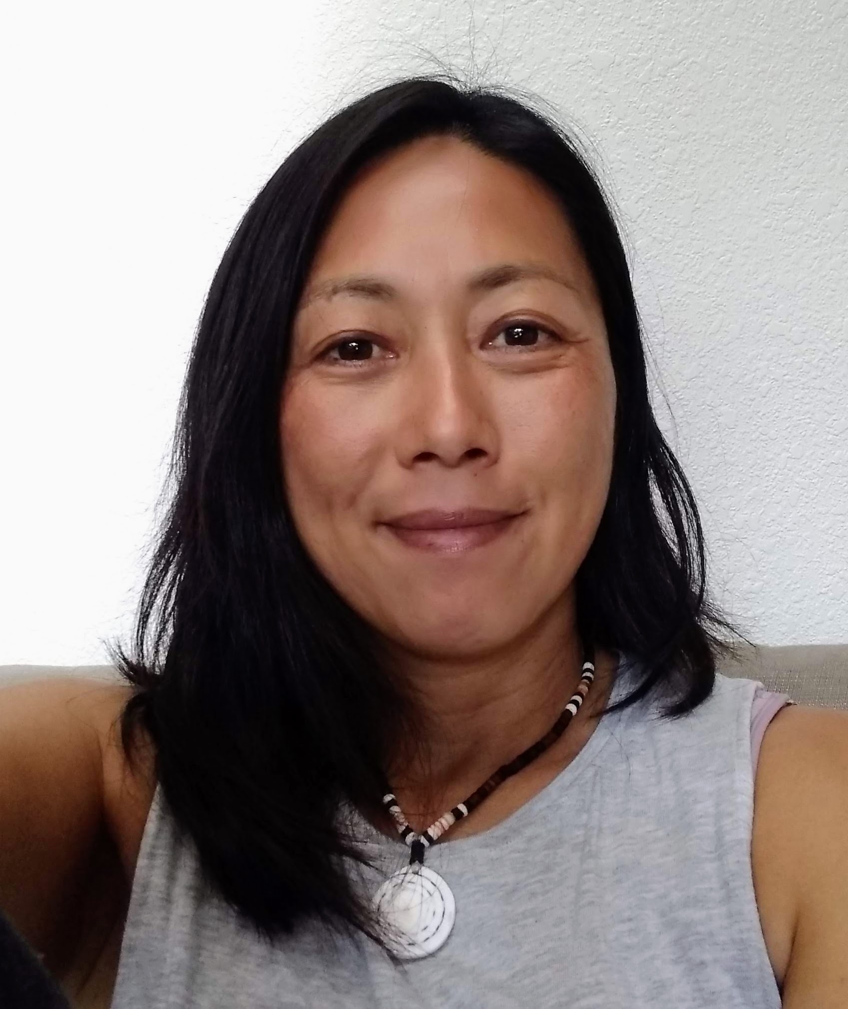 brown hair woman with necklace